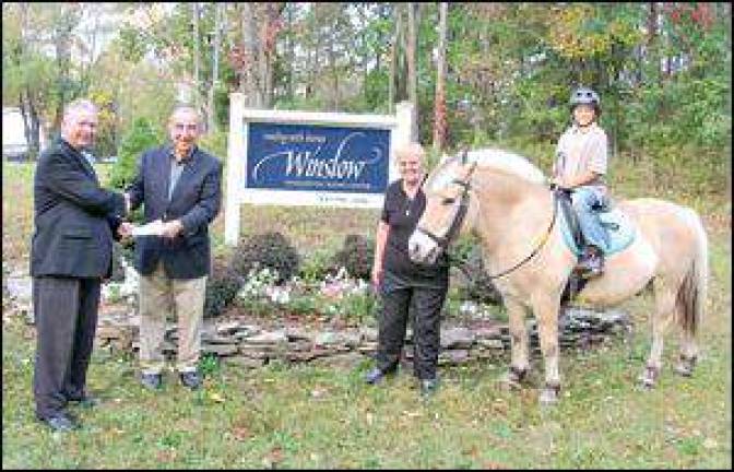 Ford Motor Credit Corporation donates $10,000 to Winslow Ford Motor Credit Corporation donates $10,000 to Winslow