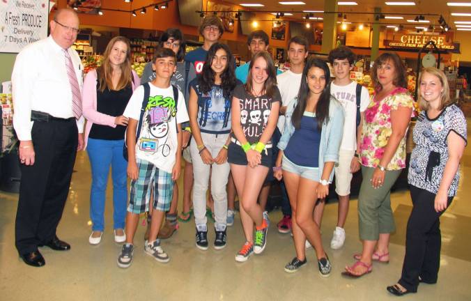 Spanish exchange students visit Warwick ShopRite Photo by Roger Gavan On Wednesday, July 11, a group of 14 Spanish exchange students visiting Warwick as part of a cultural exchange program arrived at Warwick ShopRite, where they purchased items for the Warwick Valley Ecumenical Councilís Food Pantry. The adults from left are: Warwick ShopRite Store Director Bob Courtenay and Tour Leader Eva Hinojar (at left) and Tiffany Megna and ShopRite Shopper Advocate Michele Laurice (at far right).