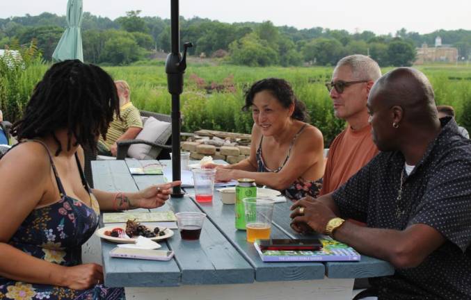 Backyard gardeners open their gates for Kitchen Garden Tour Tour-goers share garden tips and compare notes from the day at the after party in Chester, NY, overlooking the black dirt.