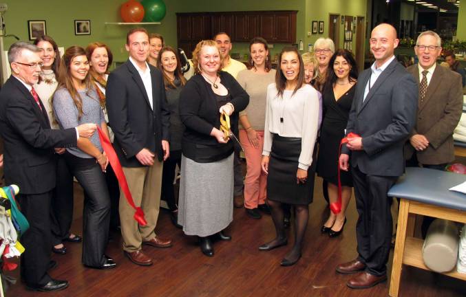 Access Physical Therapy & Wellness celebrate with ribbon-cutting ceremony Photo by Roger Gavan On Tuesday evening, Dec. 8, Town of Warwick Supervisor Michael Sweeton (far left) and Michael Johndrow (far right), executive director of the Warwick Valley Chamber of Commerce, joined Access owners, executives and members of Bon Secours Charity Health System Outpatient Facilities for a celebration and ribbon-cutting at the renovated facility.