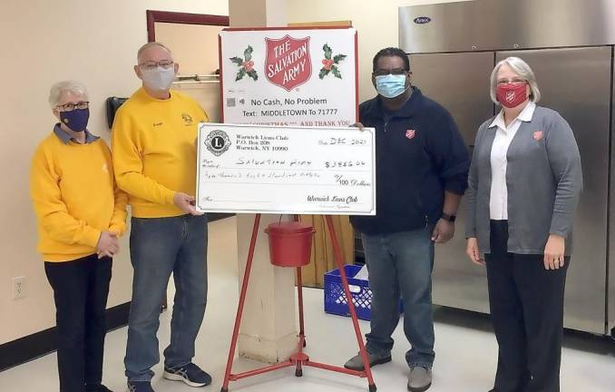 Pictured from left to right are Lion Kathy McManus, Lion George McManus, Lt. Cesar Villazana and Salvation Army Major Mary Moore. Provided photo