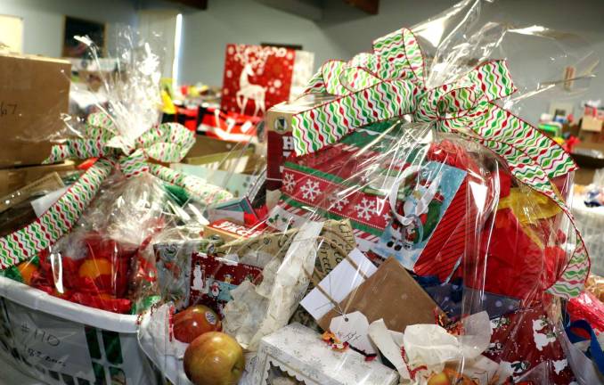 Warwick Ecumenical Food Pantry distributes more than 200 Christmas food baskets Donors prepared attractive Christmas baskets fir their "adopted" families.