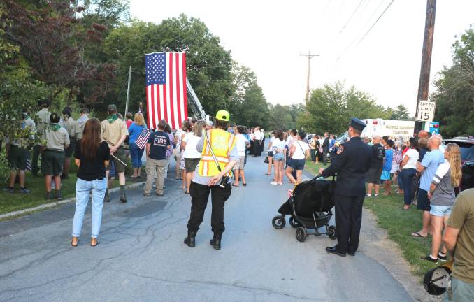 The well attended ceremony concluded with a benediction, the solemn drone of the bagpipe played by Scott Lemin and the bugler playing Taps.