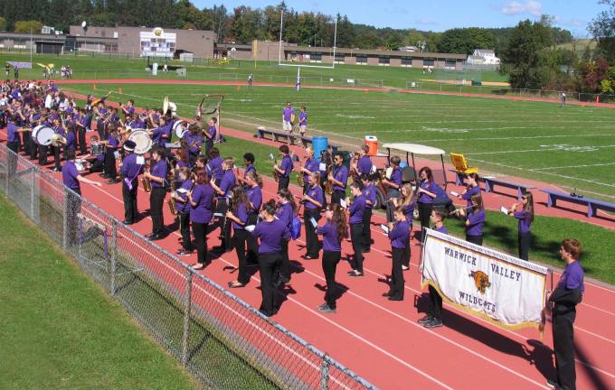 Homecoming Day events precede a Wildcat victory over the Kingston Tigers Photos by Roger Gavan The marchers then walked a pre-game lap around the field, ending with the Wildcat Marching Band playing our national anthem.