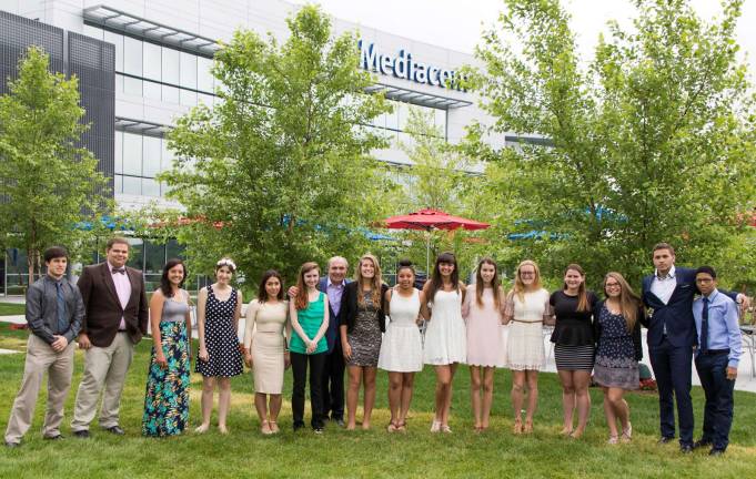 Mediacom Entrepreneur of Tomorrow award winners honored Pictured left to right: Stephen Cushing (John S. Burke Catholic High School), John Lunden (Valley Central High School), Brittany Milz (S.S. Seward Institute), Erin Proctor (James I. OþÄôNeill High School), Jessica Peredes-Espinoza (Newburgh Free Academy), Elizabeth Davis (Cornwall High School), Rocco B. Commisso (Mediacom Chairman and CEO), Courtney Baxter (Minisink Valley High School), Cierra DeVeaux (Middletown High School), Casey Krauss (Goshen Central High School), Lauren Lacroix (Washingtonville High School), Christy McCoy (Monroe-Woodbury High School), Kayla Shevlin (Port Jervis High School), Alexandria Whitmore (Warwick Valley High School), Adrian Fernandez (Mount Saint Michael Academy and current Rocco B. Commisso American Dream Scholar) and Imanol Fernandez (Mount Saint Michael Academy and current Rocco B. Commisso American Dream Scholar). Not pictured: Jazmin Savigne (Chester Academy).