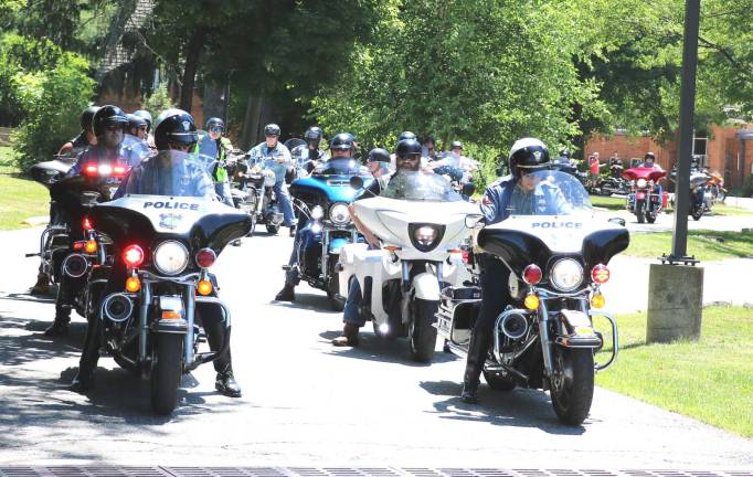 St. Stephen's seventh annual motorcycle blessing and ride draws more than 70 participants On Saturday, June 30, Father Angelo Micciulla (on right behind police escort), former parochial vicar at Warwick’s RC Church of St. Stephen the First Martyr, joined a formation of over 70 motorcycle enthusiasts, led by Warwick Police, on a 40-mile ride through local country roads.