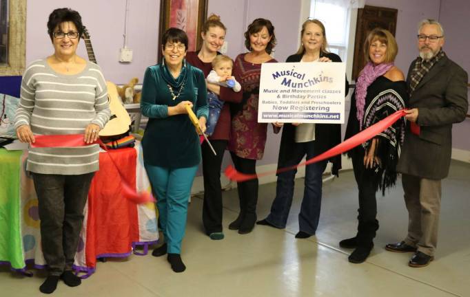 Photo by Roger Gavan From left, Warwick Valley Chamber of Commerce past president Sherry Bukovcan, Musical Munchkins Director Andrea Soberman, Melissa Padham Maas with her daughter Leila, 7 months, Hudson Valley Dance Center Director Marguerite McNeilly, chamber office manager Sarah Armand, President Mechelle Casciotta and Mayor Michael Newhard.