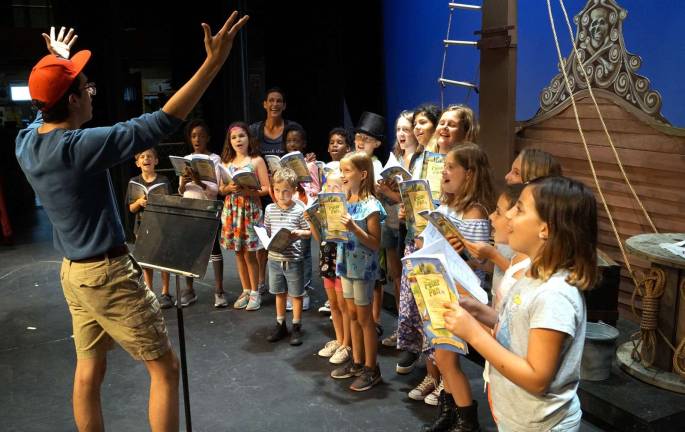 It’s a family affair Provided photo Musical director William Odell works his magic with the cast of Peter Pan Jr.