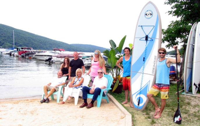 Warwick chamber to host mixer at Willow Point Marina and Jersey Paddleboards in Greenwood Lake Photo by Roger Gavan Gathered on the sandy Greenwood Lake beach front at Willow Point Marina to finalize plans for The Warwick Valley Chamber of Commerce July 28 Summer Social are front from left, Greenwood Lake Chamber of Commerce Board Chair Tony Trimarco, Warwick Valley Chamber of Commerce Event Planner Janine Dethmers and Executive Director Michael Johndrow. Rear from left, Willow Point Marina Assistant Lisa Rose, Manager Thomas Schweigert, Jersey Paddle Boards co-owners Micki Lees and Tyler Lees and employee Nick Carfello.