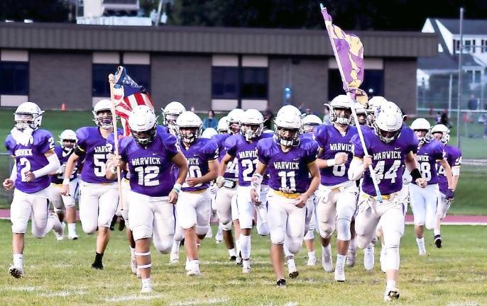 Nick Dimarco (12) and Jake Durie (44) lead the Warwick Valley Wildcats to open the 2021 football season last Friday night, Sept. 3. Warwick defeated Valley Central 25–20 in front of nearly 3,000 fans at Warwick Valley High School. The Wildcats will play Goshen in the annual Spirit Trophy Game. on Sept. 11. Story and photo on last week’s game can be found on page 14. Photo by Al Konikowski.