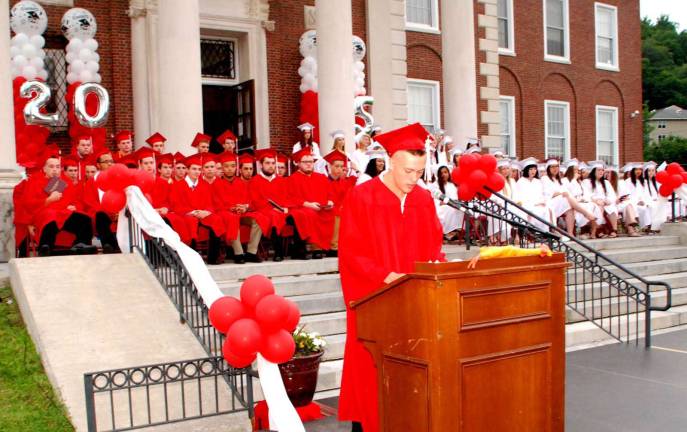 Cheers to the George F. Baker High School Class of 2015 In his farewell remarks, Zachary Messick presented a rubber chicken to Principal Art Schouten.