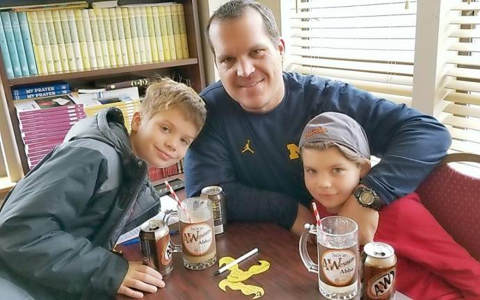 Jaden and Liam Klausner of Monroe with their dad Marc at A&amp;Wesome Aba Father’s Day event at Chabad Hebrew School.