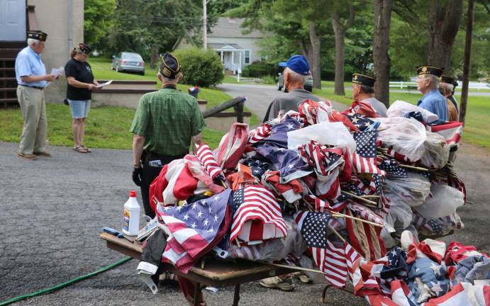 Warwick's American Legion Post 214 conducts flag disposal ceremony Photos by Roger Gavan After a brief ceremony and a prayer, the flags were ordered to be destroyed by burning, the proper and most dignified way to dispose of an American Flag that is no longer serviceable.