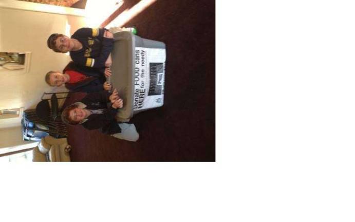Menorah of Giving event at Galleria Even kids are helping out. Here, E. Weinstein, E. Moscowitz and J. Forman are out collecting cans for the Menorah of Giving.