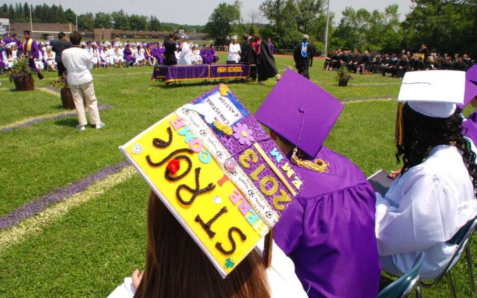 The Warwick Valley Class of 2013 Photo by Ed Bailey The awarding of diplomas.