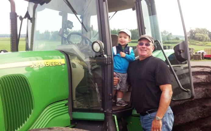 Pine Island Chamber hosts Touch-A-Tractor event The Pine Island Chamber of Commerce is hosting a "Touch-A-Tractor" event on Aug. 18 at the Black Dirt Farmerís Market, where local farmers will be displaying their tractors for children of all ages to experience. Pictured here is Johnny DeBuck, enjoying the view from Grandpa Leonard DeBuckís tractor.