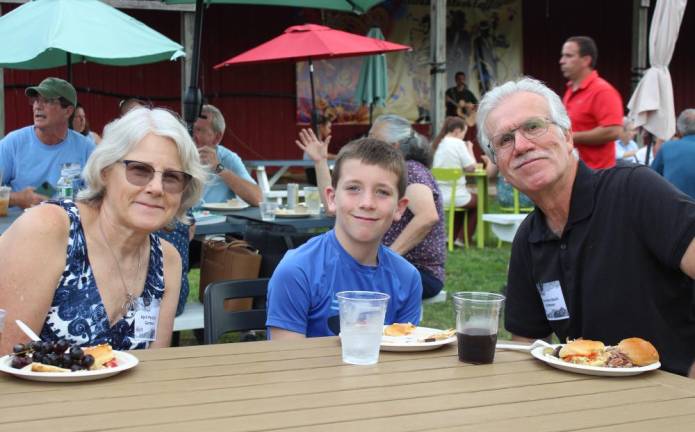 Backyard gardeners open their gates for Kitchen Garden Tour The Perciballis of Lafayette, NJ with their grandson, after a day giving tours of their garden. The Perciballis are past winners of the tour.