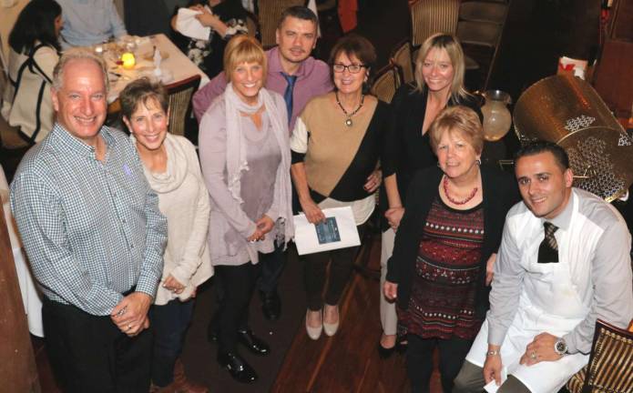 Backpack Snack Attack Fall Fling Dinner and raffle raises $7,085 Photo by Roger Gavan Grappa partners and Backpack Snack volunteers pose with raffle winners present at the Fall Fling Dinner.