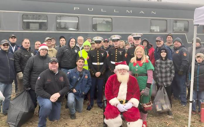 Warwick firefighters pose with Santa at the annual Toys For Tots Toy Train event at Kuiken Brothers on Sunday, Dec. 1.
