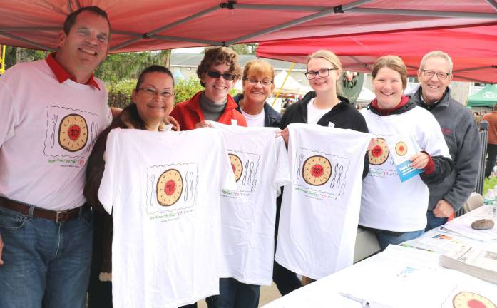 Applefest 2018 draws huge crowds Members of the Warwick Valley Chamber of Commerce, including Executive Director Michael Johndrow (right), spent the day on South Street selling Applefest T-shirts and handing out maps and official guides.