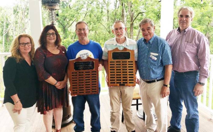 Warwick’s Citizen of the Year committee leaders include, left to right, Co-chairs Cindy Vander Plaat and Patti Dempster; Warwick Valley Rotary Club President Neil Sinclair, holding the Rotary plaque listing recent winners; Master of Ceremonies Michael Sweeton with the Jaycee plaque honoring winners from 1968-1999; Stan Martin and Leo R. Kaytes. The Warwick Citizens of the Year plaques are displayed at Town Hall. Photo by Jim LaPlante