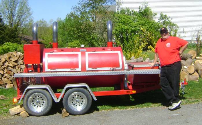 Annual BBQ and Blues Experience set for Applewood Winery Dan "Chumley" Lemire, seen here with his smoker, is the BBQ man at Applewood. The owner of Chumley's restaurant in Florida will be providing the barbecue at the winery's BBQ and Blues Experience.