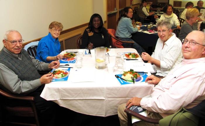 No complaints about this hospital food Pausing inbetween bites of the specially prepared dish are, clockwise from left, Jerry and Lucy Fischetti, Hakimah Alzahra and Cindy and Vince Copello.
