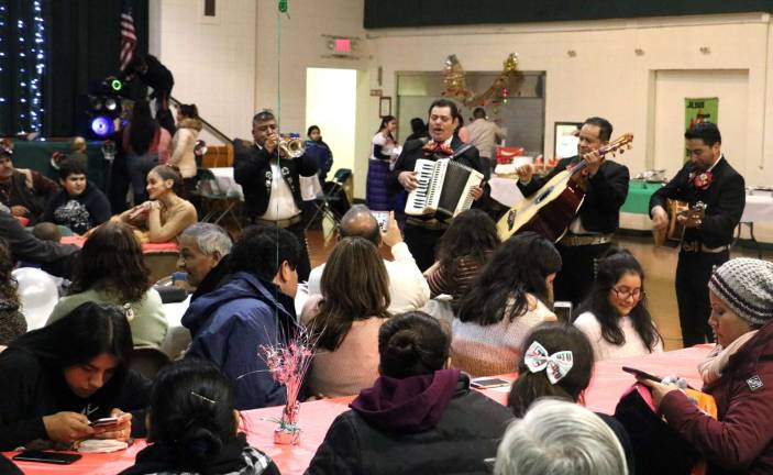 6. After the mass, everyone was invited to the school gym where the Mariachi band performed at each table.
