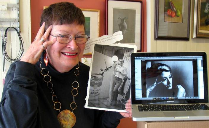 Degrees of separation, then 15 minutes of fame Photo by Roger Gavan Kokopelli owner Cathe Linton holds a photo of Andy Warhol as she displays one of the photos he took of her on her computer.