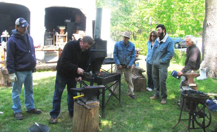 Historical Society sponsors blacksmithing class On Saturday and Sunday, April 28-29, the charcoal fires were red hot as a group of students and their instructor hammered out useful metal objects on anvils behind the historic Bairdís Tavern at 105 Main St. From left, Joe Hearon, professional blacksmith Adriaan Gerber, Robert Schmick, director of the Historical Society of the Town of Warwick, Cathy Erlean-Goddard, Orion Blake and Vic Stockman.