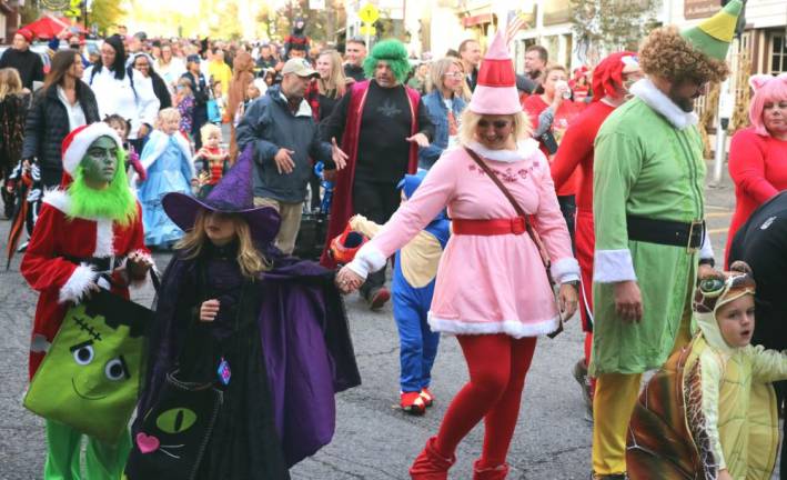A large crowd of what may have been more than 1200 ghosts, goblins, witches and an assortment of movie, cartoon and even more creative characters headed down Main Street at 5 p.m. to Railroad Avenue where they dispersed and headed out for traditional trick or treating.