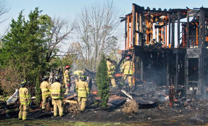 Thank you to the Warwick community Photo by Thom Cronin Firefighters work their way through the remains of a home on Jonathan Court looking for possible causes for the fire in this photograph taken on Applefest Sunday this past October.