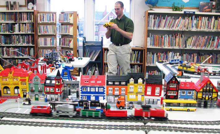 Library hosts LEGO holiday display Florida resident and library volunteer Brian McLeod has built each train and car and village piece entirely of LEGOÆ bricks.