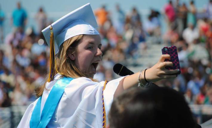 Warwick Valley Class of 2014 Senior Speaker Clare Finnegan took a selfie at the podium before speaking to her classmates.