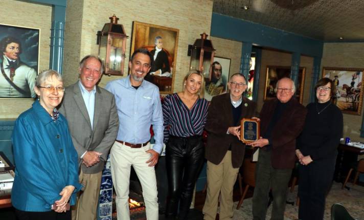 Town of Warwick Supervisor Michael Sweeton and Town Historian Professor Richard Hull presented an Historical Landmarks Preservation Award to the owners of the Old Stone House Inn and Restaurant. From left, Deputy Town Historian Sue Gardner, sixth generation Hathorn descendent Kevin Hathorn, owners Arek Kwapinski and Sylwia Kubasiak, Town Historian Richard Hull, Supervisor Michael Sweeton and Mary Ann Knight, president of the Town of Warwick Historical Society.