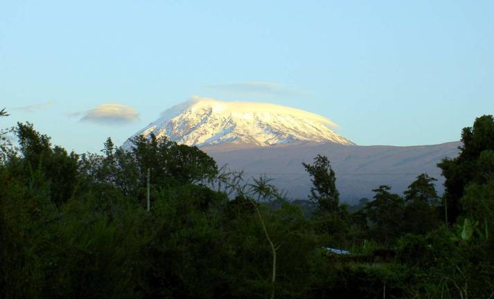 What some people will do for their relatives Attribution: Chris 73/Wikimedia Commons Mt. Kilimanjaro with its three volcanic cones, Kibo, Mawenzi and Shira, is a dormant volcanic mountain in Tanzania. It is the highest mountain in Africa and the highest free-standing mountain in the world at 5,895 metres (19,341 feet) above sea level.