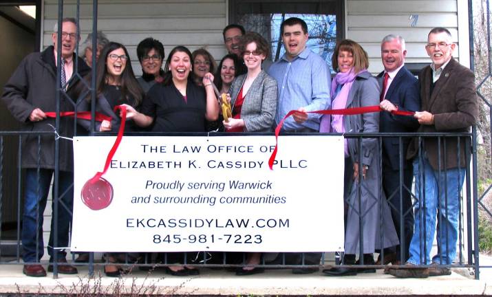 Attorney Elizabeth Cassidy celebrates opening of new office Photo by Roger Gavan On Friday, April 8, Town of Warwick Supervisor Michael Sweeton (far right) and members of the Warwick Valley Chamber of Commerce joined Cassidy (cutting ribbon center right), her husband, Jeremy Cook, and her associate attorney, Jessica Mahoney, for the grand opening of her new office.