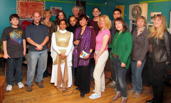 Third annual Tista Creative Arts Exhibit held at Tuscan Café Judy Battista with some of the artists: Front from left, Eric Fierstein, Kevin Abrams, Dilianna Nunez, Judy Battista, Liz Everson, Ellen Mayer and Jan Loe. Rear from left, Carol Lee, Stephanie Eichelberger, Jarabe del Sol, George Slater, Joe Ventigmilia, Manny Rodriguez and Karen Farner.