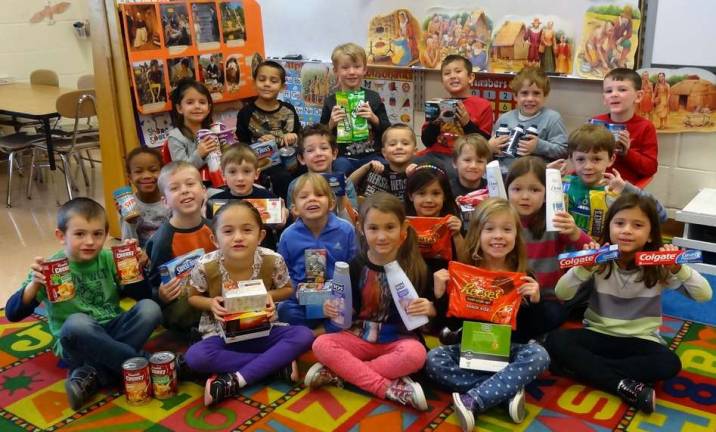 Holiday gift boxes for U.S. soldiers These are students in Christina Taylor's kindergarten class.