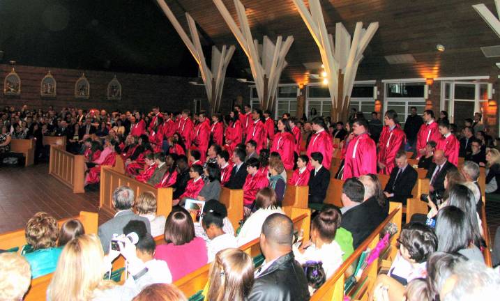 'Be sealed with the gift of the Holy Spirit' Photos by Roger Gavan On Friday and Saturday, March 22-23, approximately 130 candidates received the Sacrament of Confirmation at the Church of St. Stephen, the First Martyr, in Warwick.