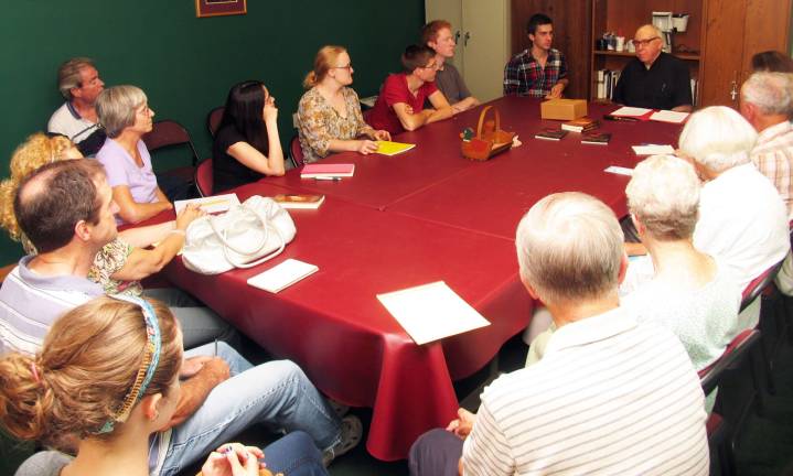 Visiting priest urges aspiring writers to learn by doing Photo by Roger Gavan The Rev. Flor McCarthy, who recently arrived from Ireland to spend his 31st summer at St. Stephenís Parish in Warwick, conducts a seminar for would-be writers.