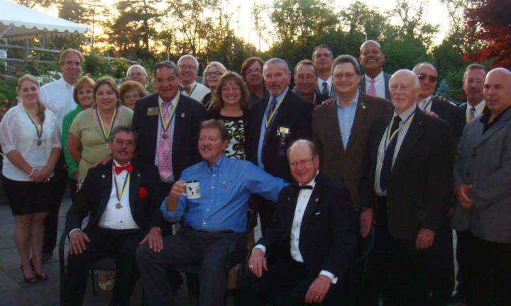 Neil Sinclair heads Warwick Rotary Club Warwick Rotarians display their prestigious Paul Harris Fellowship medallions, named for the founder of Rotary International. From left to right, front row, John Bollenbach, Cal Hargis and Edwin Wiley; middle row, Jane Wiley, Stella Kosar, Sally Wiley, Marie Bollenbach, Stan Martin, Lisette Cuba, John Buckley, Eric Heffler, Joe Baltes, and Rich Savino; back row, Leo R. Kaytes, Doug Stage, Ray Bryant, Brenda Harburger, Frank Truatt, John McGloin, Greg Klein, Wayne Patterson, Roger Gibboni and Neil Sinclair.