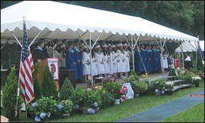 Members of Seward's Class of 2011 'Walk this Way' following graduation ceremonies Members of Seward's Class of 2011 'Walk this Way' following graduation ceremonies