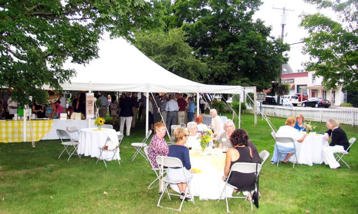 Celebrating Warwick’s history Approximately 165 guests enjoyed outdoor seating as well as gathering under the huge tent while sampling good food, local wines and other refreshments donated by local businesses and restaurants.