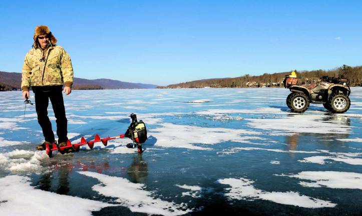 (S)no problem Photo by Don Webb Don Slater Jr. enjoys the quiet solitude of a ice fishing in the middle of Greenwood Lake.