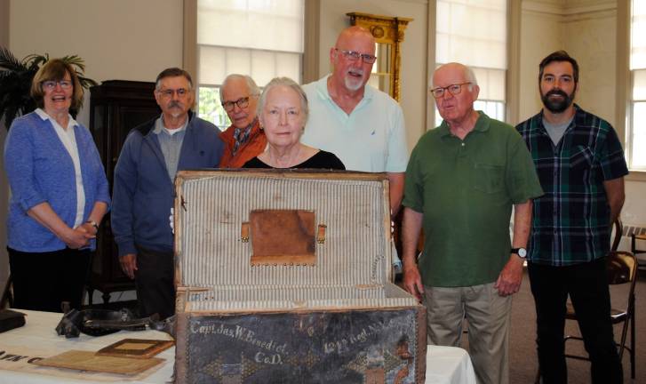A hero’s trunk comes ‘home’ Warwick Historical Society members and local historians gathered for the opening of Capt. James W. Benedict's trunk at the Warwick Historical Society on Tues., June 11. Present at the time the trunk "came home" to Warwick were (from left) Warwick Historical Society (WHS) President Ms. Mary Ann Knight, author Mr. Charles LaRocca, WHS Curator Mr. Michael Bertolini, WHS Archivist and immediate Past President Cathryn Anders, Town of Montgomery Historian Mr. John Pennings, Warwick Town Historian Dr. Richard Hull, and WHS member Christofer Gass.