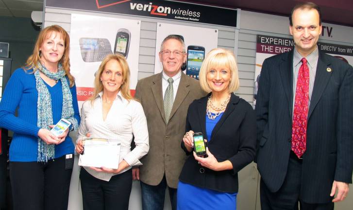 Warwick Chamber to host winter mixer at Alteva, formerly known as WVT Commnications Photo by Roger Gavan Gathered around the latest communications equipment at Alteva to plan the Thursday evening, Feb. 28. Warwick Valley Chamber of Commerce after hours winter business social are: From left, Alteva Directory Manager Kathleen Neu, Marketing Director Jean Beattie, Warwick Valley Chamber of Commerce Executive Director Michael Johndrow, Chamber Programs Co-Chair Janine Dethmers, and Chamber of Commerce President Paul Rafanello.