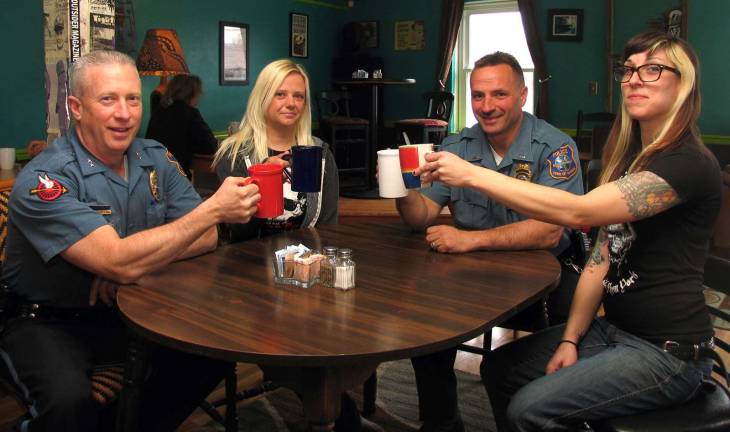 'Coffee with a Cop' On Tuesday May 12, from 8 to 9:30 a.m., local residents are invited to have "Coffee with a Cop," at the Tuscan Cafe on South Street in the Village of Warwick. Clockwise from left, Warwick Police Thomas McGovern, Jr., cafe co-owner Cristie Ranieri, Warwick Police Lt. John Rader and co-owner Kristen Ciliberti.