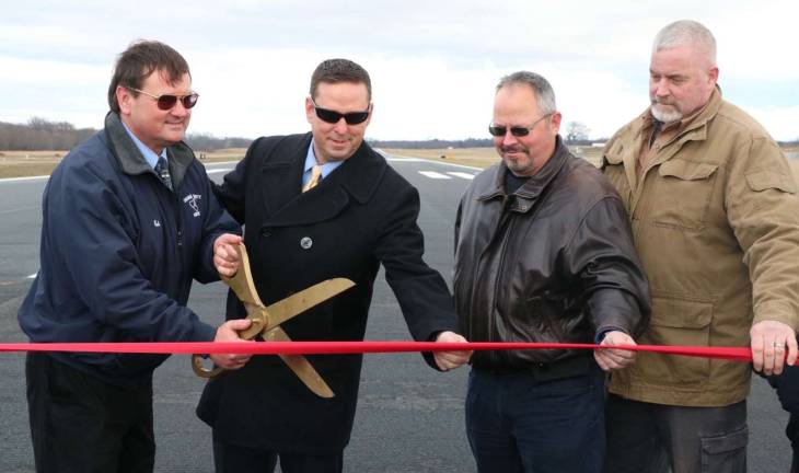 Orange County Airport hosts ribbon cutting to recognize completion of $30 million runway realignment project Photos provided by Orange County Pictured from left to right are: Ed Magryta, Orange County’s Director of Aviation, Orange County Executive Steven M. Neuhaus, Chairman of the Legislature Steve Brescia and Town of Montgomery Supervisor Rod Winchell on Orange County Airport’s new runway.