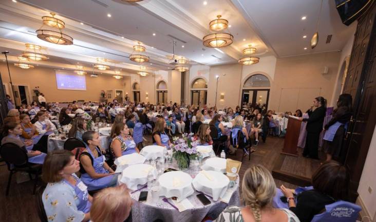 Raz Mizrahi of the Israel Defense Forces, addresses over 150 women and teens at Chabad of Orange County’s recent Mega Challah Bake, led by Chana Burston. Mizrahi was flown to Orange County to share her experience of recuperating after being wounded while on duty. Mizrahi was killed in the recent attacks in Israel by Hamas.